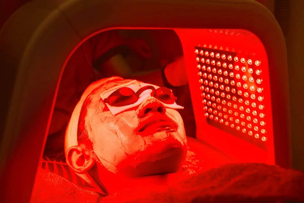 Red LED light therapy facial treatment in Cleveland, OH with protective eye gear