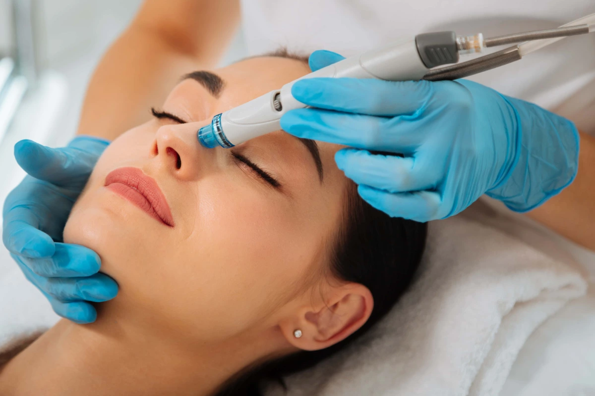 Woman receiving a HydraFacial treatment for refreshed, hydrated skin.