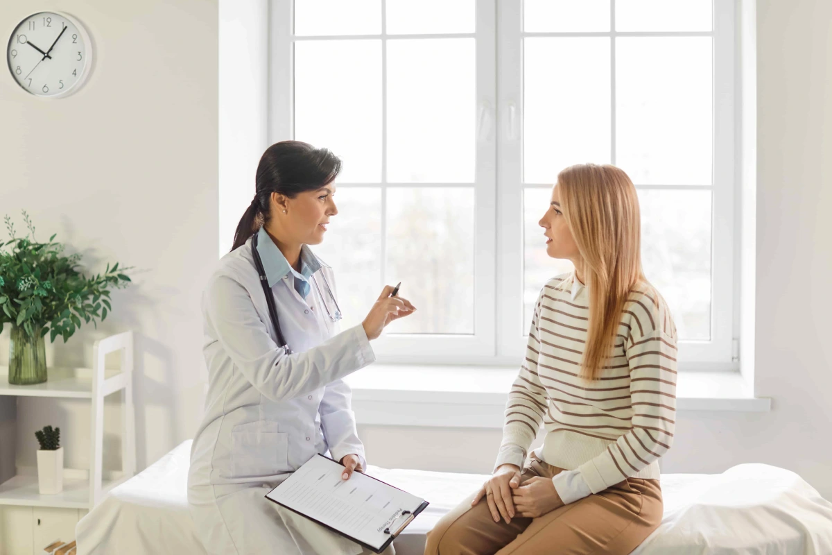 Woman receiving personalized hormone optimization care from a professional